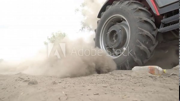 Street sweeping and cleaning machine. A machine for sweeping and cleaning streets using a mechanical brush raises a cloud of dust.