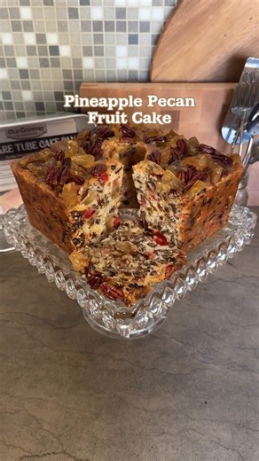 The pan is available at oldcountrykitchenware.com I put all my favorite fruit and nuts in this giant 9 1/2 pound fruit cake! It's juicy, sweet and nutty and perfect for sharing. Mile High Pineapple Pecan Fruit Cake 2 1/2 sticks (1 1/4 cup) butter, softened 2 1/4 cups sugar 5 eggs⁠⁠, room temperature 1/2 teaspoon baking powder 1 tablespoon vanilla extract 1 teaspoon salt 2/3 cup whole buttermilk, room temperature 4 1/2 cups cake flour or White Lily All Purpose Flour, divided 12 oz (about 2 cups) 