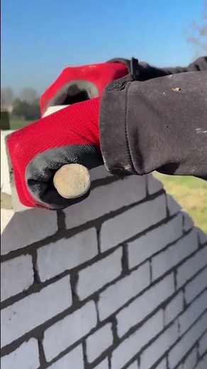 the process of laying triangular bricks at the end of the roof wall #construction #bricks #popular