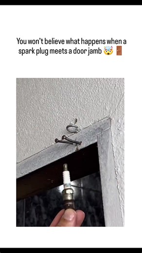 Trend Flow on Instagram: "The X post features a 61-second DIY video showcasing a viral home-hack: hammering a spark plug into a door jamb to anchor its metal base, then adding a wired loop to create a simple latch—often used as a quick privacy fix for bathroom doors. The trick first gained traction in mid-2025 on TikTok and Facebook, where creators dubbed it a “marriage-saving” solution. It uses the spark plug’s threaded body to easily grip into wood with minimal tools, costing less than $5 to m