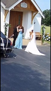 At 11:14 AM in broad daylight, CCTV footage outside a small chapel captured a moment no bride should ever have to see. The groom was standing near the entrance with another woman, talking closely, laughing, and then leaning in to kiss her like it was completely normal. They thought no one was around. They thought no one would ever find out. But the cameras caught everything… and so did his wife. Still in her wedding dress, bouquet in hand, she walked around the corner expecting to find her husba