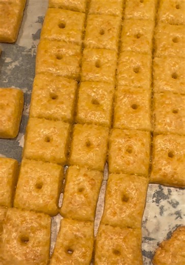 Ingredients: 8 oz. block yellow cheddar cheese ¼ cup cold unsalted butter 1 tablespoon salt 1 cup all-purpose flour Ice water Preheat the oven to 375°F. Cut the block of cheese and butter into 2” cubes and add to the bowl of a food processor. Add the salt, then pulse until the cheese and butter form a rough dough. Add the flour to the food processor and pulse until the mix looks like clumpy sand. Add the ice water to the food processor one tablespoon at a time, until a dough ball forms. Turn the