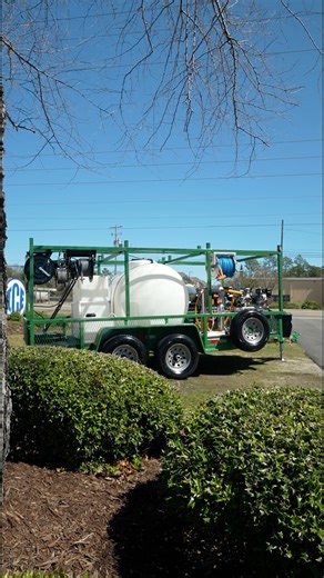 Green Mud Dog pressure washer trailer with overhead ladder racks and Comet gas powered soft wash with Midwest Manifold. | ICE Industrial Cleaning Equipment Co.