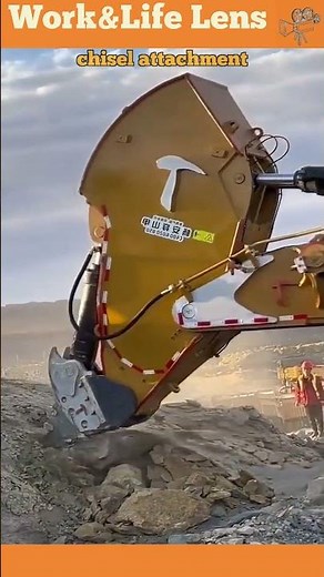The video shows a rock breaker with a chisel attachment, breaking large rocks for construction work.