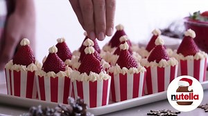 Bake Ho-Ho-Homemade Mini Santa Cupcakes with Nutella®! Discover holiday recipes at Nutella.com. | Nutella