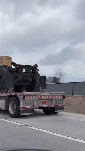 White Peterbilt With Yellow Fenders Hauling A Military Heavy Expanded Mobility Tactical Truck💛😎