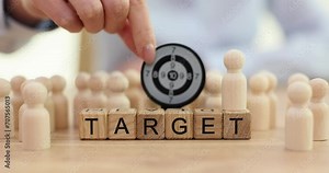 Wooden cubes configured into motivating term Target on table