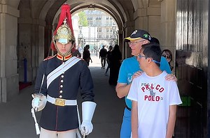 WATCH | The sweet reason a royal guard broke his infamous stoic stance