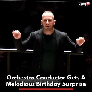 Orchestra Conductor Was All Set To Direct A Musical Performance. But He Didn't Know He Was In For A Melodiuos Birthday Surprise! Watch the video till the end #viralvideo #trendingvideo #Orchestra #Music #MusicalPerformance #Birthday #BirthdaySurprise | News18
