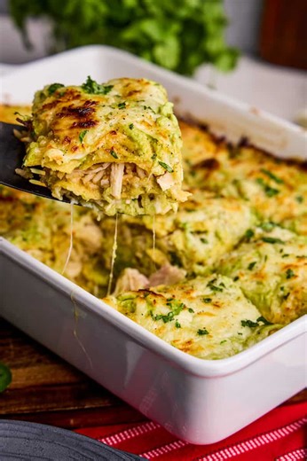 This easy chicken enchilada casserole is made with a delicious avocado cream sauce that will have you making it again and again! https://thestayathomechef.com/chicken-enchilada-casserole/ | The Stay At Home Chef