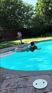 Two year old is jumping off the diving board for the first time!