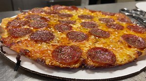 The Fricano’s Pepperoni Pizza Pie, It’s real tough to bake this pizza pie as it has a mind of its own in the oven, but it’s worth it. Our special recipe pepperoni flavor that gets baked into our super soft, fine cheese, drives people crazy! | Fricano's Pizza Tavern