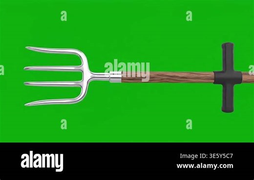 A close-up shot of a gardening pitchfork tool with a wooden handle on a green screen background Stock Video Footage - Alamy