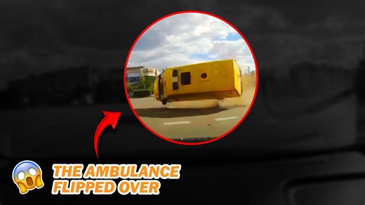 Collision causes ambulance to flip over