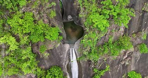 An up-close shot showcasing a waterfall, majestic mountains, and lush foliage of bridal falls on the way to baguio Stock Video