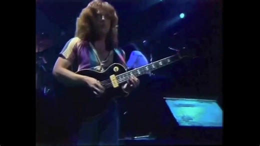 In the early 1980s, Saga was one of the most prominent progressive rock bands, known for their complex blend of powerful rock and electronic elements. The song "Wind Him Up" is one of their most beloved works, a classic progressive rock anthem with a driving rhythm, signature electronic keyboard work, and a fascinating story. The song was written by all the members of the band: Michael Sadler, Jim Crichton, Ian Crichton, Peter Rochon, and Steve Negus. "Wind Him Up" was released in 1981, on the b