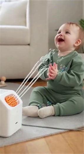 Adorable Baby Discovers Bubble Machine Fun