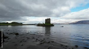 Aerial forward drone shot .Castle Stalker in Argyll, Scotland. This castle is situated on a tidal islet on Loch Laich, midway between Oban and Glen Coe.