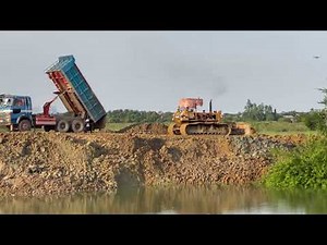 Best action big project land filling up showing skill operator dozer pushing soil with truck