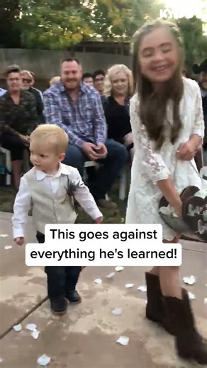 Watch ring bearer's adorable reaction! 🤣 #weddings #flowers #cute #shorts