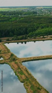 Aerial View Retention Basins, Wet Pond, Wet Detention Basin Or Stormwater Management Pond, Is An Artificial Pond With Vegetation Around The Perimeter, And Includes A Permanent Pool Of Water In Its