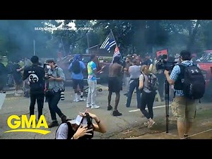 Armed militia groups face off against counter-protesters in Georgia