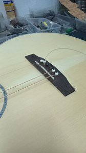 **Guitar string pins** (also known as **bridge pins**) are small pegs used to secure the strings in the bridge of an acoustic guitar. These pins are essential for holding the ball ends of the strings in place and ensuring proper string tension and vibration transfer to the soundboard. ### Types of Guitar Bridge Pins: 1. **Plastic Pins**: Common on entry-level guitars. They're affordable but not as durable or aesthetically pleasing as other materials. 2. **Wooden Pins**: Found on higher-end guita