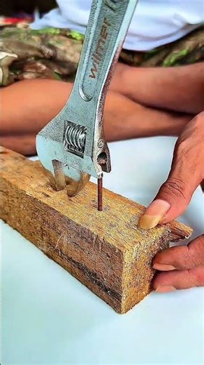 Rusty nail removed with adjustable wrench