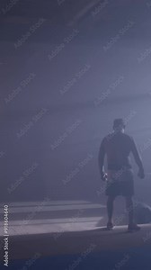 Empty modern fight club with punching bags of different shapes for practicing martial arts. Boxer in empty gym