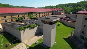 IOWA - 6.28.2024 - Excellent aerial view circling counter-clockwise around a guard tower at the Iowa State Penitentiary.