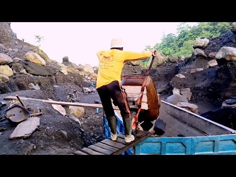 Manually Loading Stones into Trucks 