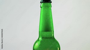 Abstract background with a bottle of beer, beer in a bottle with a closed cap, a bottle of beer with effects