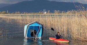 Inflatable roof-top tent camps on your car or in the water