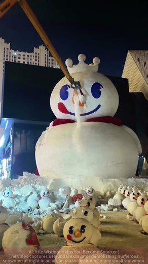 Excavator Demolishing Snowmen! At Night in the Plaza, a Big Excavator “Destroys” Snowmen One by One