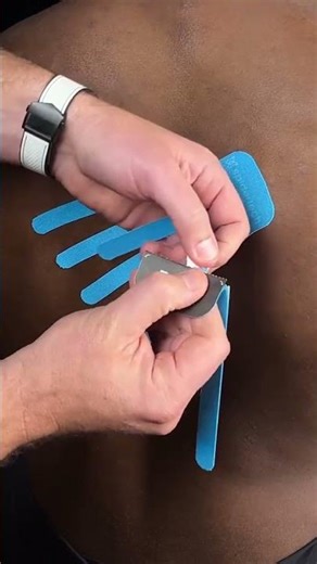 Taping For Lower Trap Activation. Comment "Tape" Below To Unlock Our Masterclass.