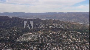 Aerial view of the Griffith Observatory looking north with Griffith Park, the Los Feliz Estates, the Hollywood Sign, Hollywood Blvd, the Greek Theater and Thai Town visible in the foreground