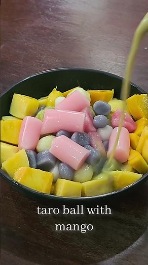 Homemade taro balls in every color topped with matcha milk and mango #dessert #satisfying