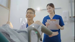 Male asian doctor doing internal examination on female patient at hospital room. They discussing about Illness with female patient at hospital, gynecological examination, conducting a pelvic exam