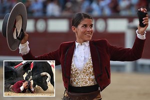 Female bullfighter poses with the severed EAR of bull that almost gored her