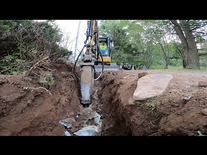 Mini Excavator Hammering Rock