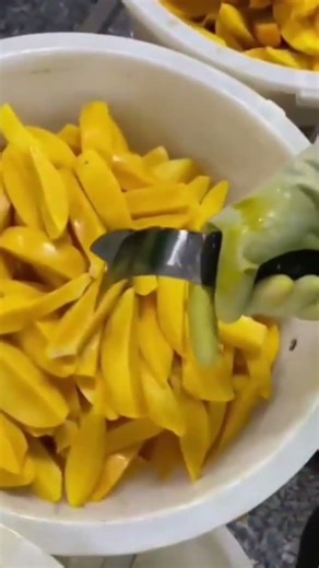 make the mango cut by using a slicer that immediately slices it into three parts