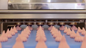 Cakes on automatic conveyor belt , process of baking in confectionery factory. | Premium Stock Video Footage