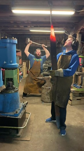 Excited Blacksmith Forging Big Sword