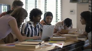 Group of students learns at lecture room. Young people studying in university or pupil sitting at school lesson. Multi cultural teens talking at auditorium. Modern education indoors of college hall