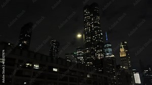 Centre Street and Chambers St off Brooklyn Bridge with Freedom Tower and buildings overhead in Downtown Manhattan at night in New York City NYC