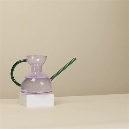 Handcrafted borosilicate glass watering can bring a touch of elegance to your everyday plant care routine. Its stunning design also makes it a beautiful decor piece, doubling as a versatile flower vase or plant propagation vessel. Makes a beautiful gift for plant and design lovers alike.