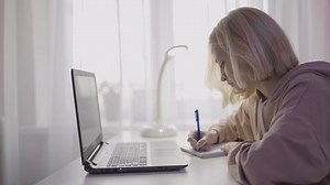 Blonde Teenager Girl Doing Homework Behind Stock Footage Video (100% Royalty-free) 1082276279 | Shutterstock
