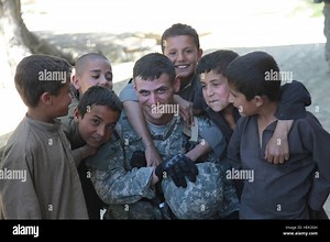 U.S. Army soldiers conduct a dismounted patrol through Bagram Bazaar in Parwan province, Afghanistan, engaging with village elders and local residents to gather information after a recent attack on Bagram Airfield Stock Photo - Alamy