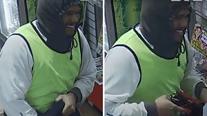 Man smiles, pulls gun in robbery