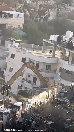 ‎🇵🇸 عين على فلسطين | Eye on Palestine‎ on Instagram‎: "🚨 13 Families Face Displacement as Occupation Forces Begin Demolishing Residential Building in Silwan. Israeli occupation forces have begun the demolition of a residential building in the Wadi Qadum neighborhood of Silwan, located in occupied Jerusalem. This move threatens to displace 13 families, leaving dozens of residents, including children and the elderly, without shelter. This action is part of an ongoing escalation of home demoliti